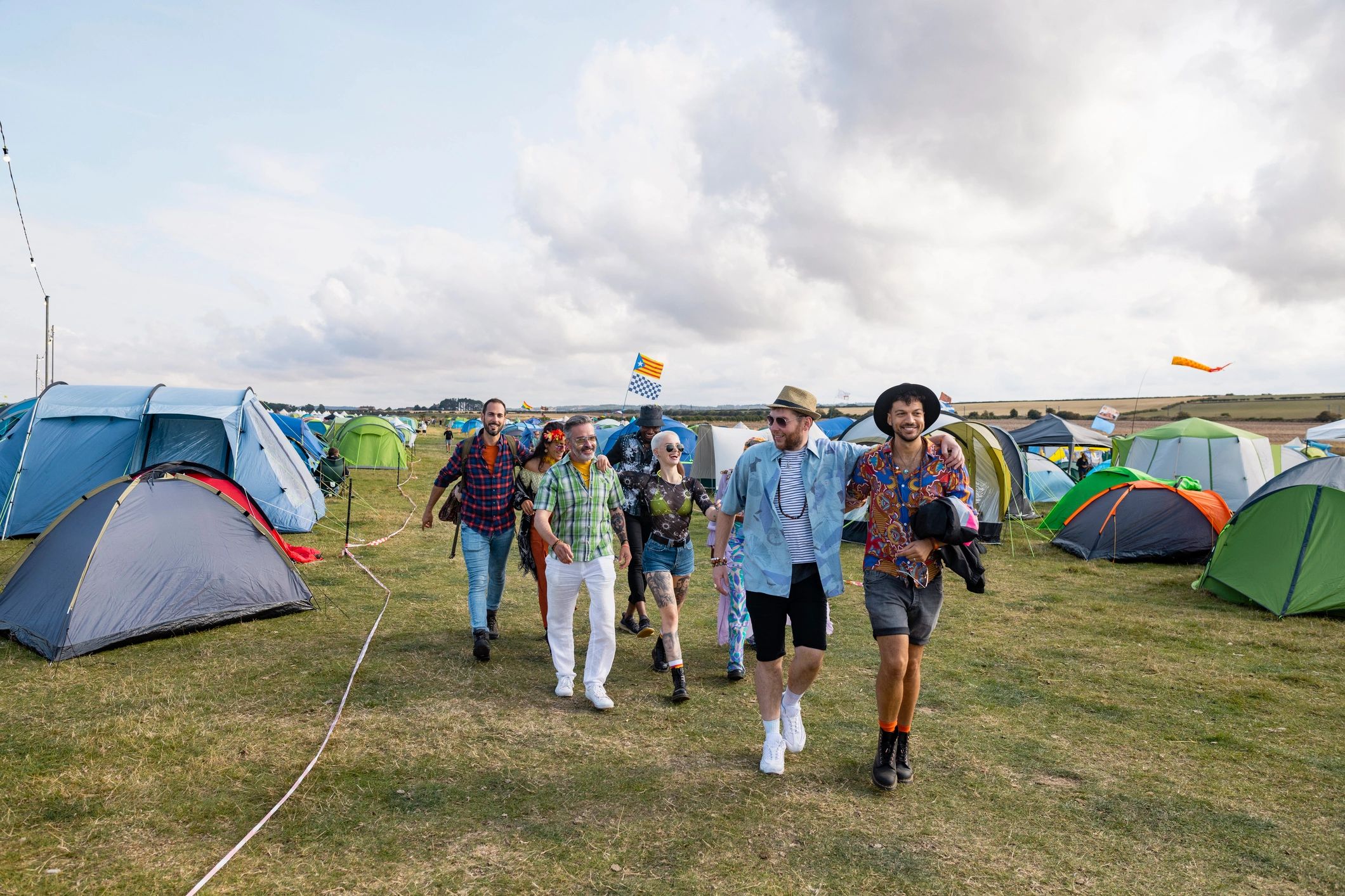 Festivalgoers walking toward a music area