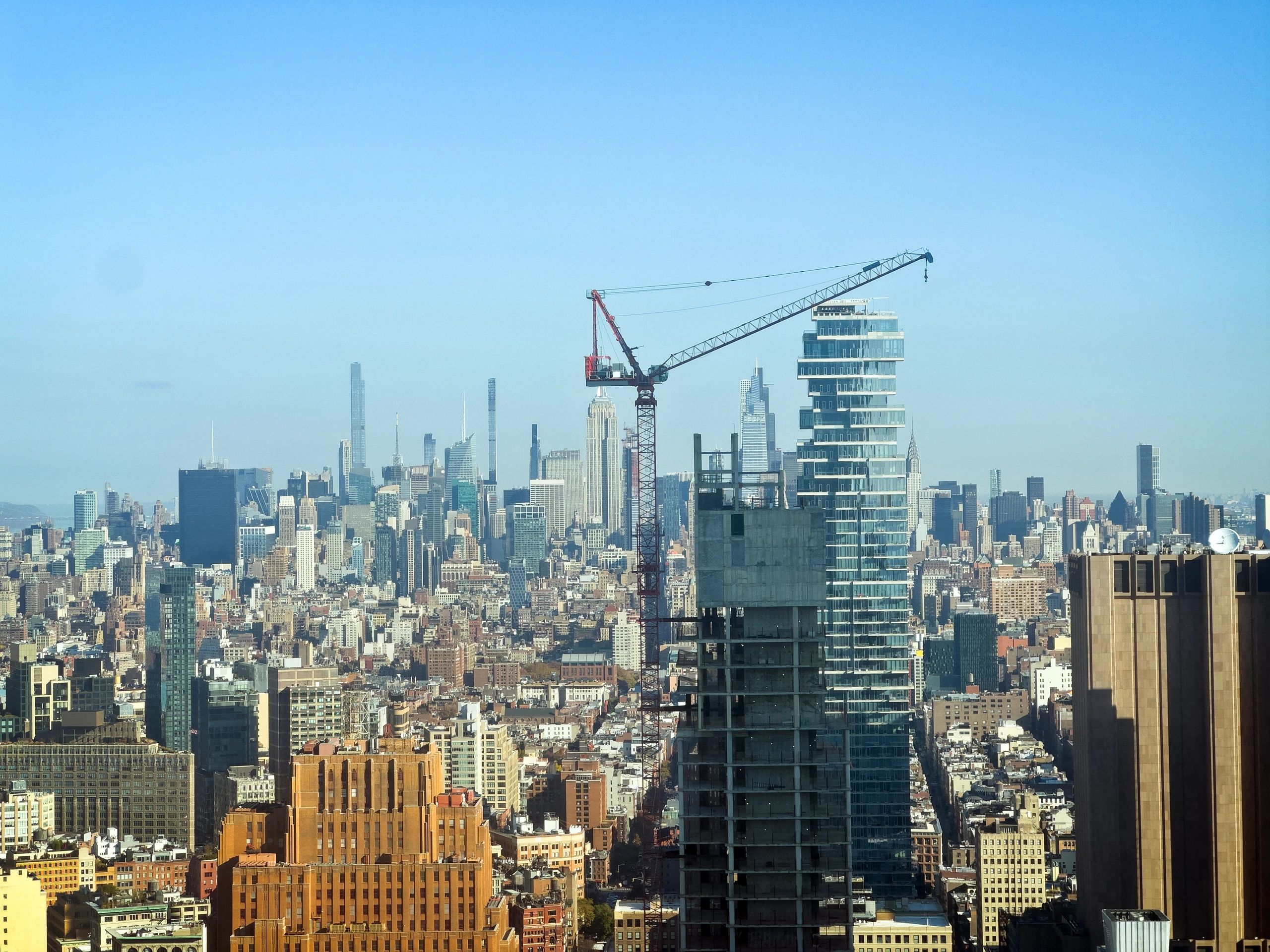 City skyline with construction crane representing political and civic change