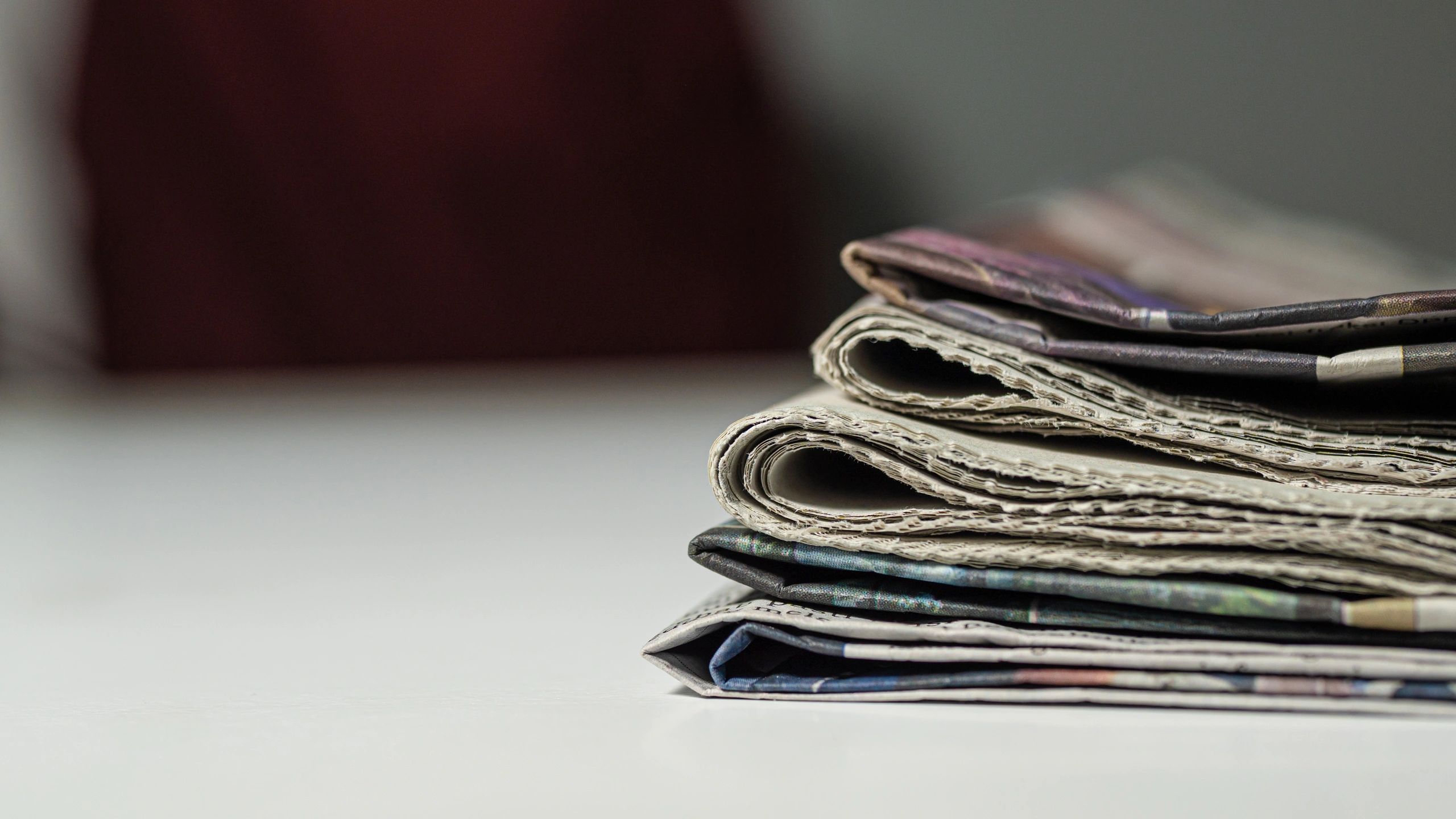 Close-up of stacked newspapers